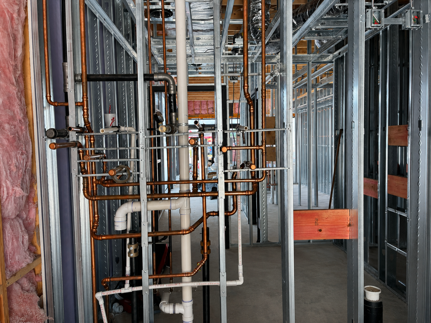 Interior copper and PVC plumbing rough-in at Chipotle Charlotte