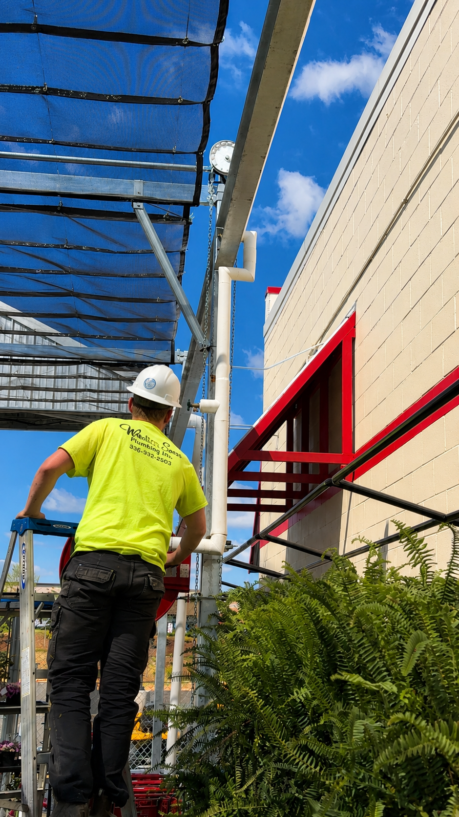 Webster & Sons plumber installing exterior piping at Tractor Supply Co. Mebane